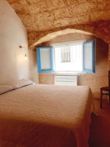 Postel nebo postele na pokoji v ubytování Corte D'Amore - Home Salento com