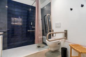 a bathroom with a toilet and a glass shower at La Réserve-Comporta by Terresens in Carvalhal +40 photos