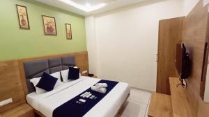 Postel nebo postele na pokoji v ubytování Hotel Suncity