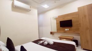 TV a/nebo společenská místnost v ubytování Hotel Suncity