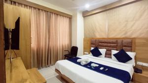 Postel nebo postele na pokoji v ubytování Hotel Suncity