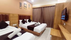 TV a/nebo společenská místnost v ubytování Hotel Suncity