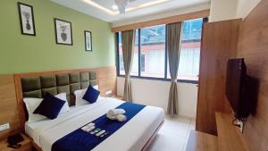 Postel nebo postele na pokoji v ubytování Hotel Suncity
