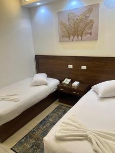 Voodi või voodid majutusasutuse Salma Hotel Cairo toas