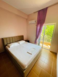 Postel nebo postele na pokoji v ubytování Bleta Rooms