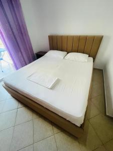 Postel nebo postele na pokoji v ubytování Bleta Rooms