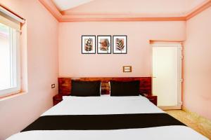 Postel nebo postele na pokoji v ubytování Hotel O Amodam Resort