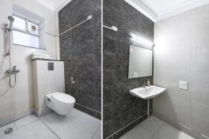 a bathroom with a shower and a toilet and a sink at Gazelle Inn in Gurgaon +23 photos