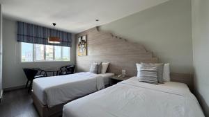 Ένα ή περισσότερα κρεβάτια σε δωμάτιο στο Methavalai Residence Hotel +48 φωτογραφίες