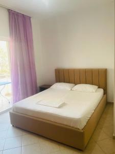 Postel nebo postele na pokoji v ubytování Bleta Rooms