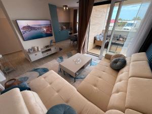 a living room with a couch and a tv at Ferula apartment Vir in Vir