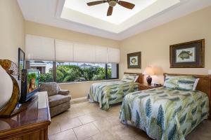 Ένα ή περισσότερα κρεβάτια σε δωμάτιο στο 2BR ocean and sunset views in Mauna Lani point +19 φωτογραφίες
