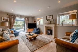 a living room with a couch and a fireplace at Johns Cottage in Hampsthwaite