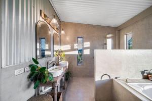 a bathroom with three sinks and a tub and two sinks at Linden Rose Barn in Montville +81 photos