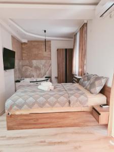 TV a/nebo společenská místnost v ubytování Aqua Apartments 2