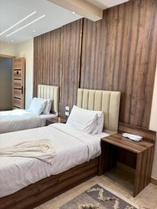 Ein Bett oder Betten in einem Zimmer der Unterkunft Ra Palace Pyramids View Hotel