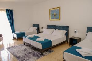 Postel nebo postele na pokoji v ubytování Hotel Palasa