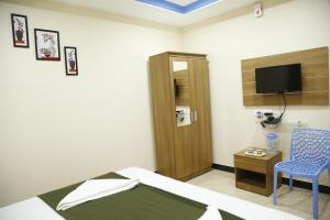 Afbeelding uit fotogalerij van Hotel New Amirtham inn in Palni