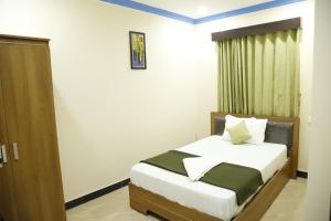 Afbeelding uit fotogalerij van Hotel New Amirtham inn in Palni +33 foto's