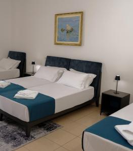Postel nebo postele na pokoji v ubytování Hotel Palasa