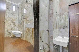 a bathroom with a sink and a toilet at Hotel O Mauris Inn & Restaurant in Mānglia