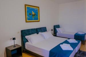 Postel nebo postele na pokoji v ubytování Hotel Palasa
