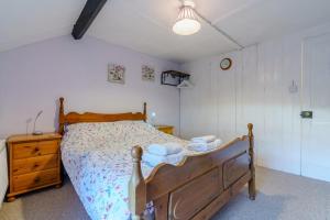 Postel nebo postele na pokoji v ubytování Alice Cottage