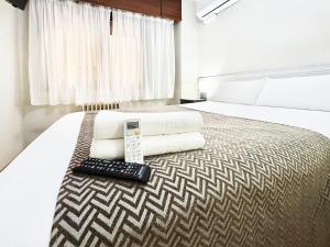 A bed or beds in a room at Pension Berceo
