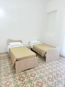 Postel nebo postele na pokoji v ubytování Casa Ferrante