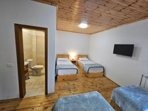 Katil atau katil-katil dalam bilik di Hotel Vermoshi TDC