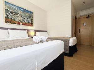 A bed or beds in a room at Pension Berceo