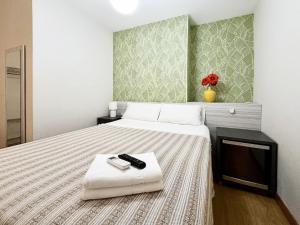 A bed or beds in a room at Pension Berceo