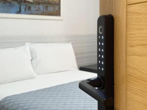 A bed or beds in a room at Pension Berceo