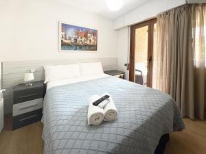 A bed or beds in a room at Pension Berceo