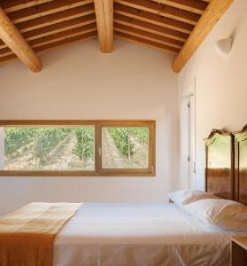 a bedroom with a bed and a large window at Agriturismo Castel Bricon in Lonigo +35 photos