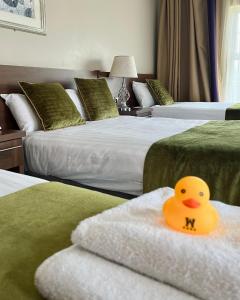 Postelja oz. postelje v sobi nastanitve Woodford Dolmen Hotel Carlow
