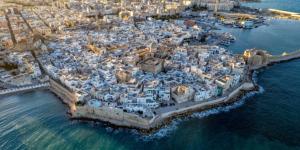 an aerial view of a city on the water at Reby's House 1 in Monopoli