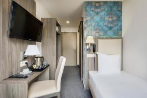 Cama o camas de una habitación en Dansaert Hotel