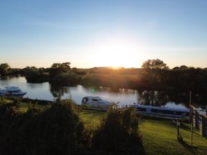 a view of a river with boats in the water at By The River Severn - Caravan 6 - Severnside Boat and Caravan Park in Tirley