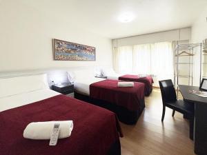 A bed or beds in a room at Pension Berceo