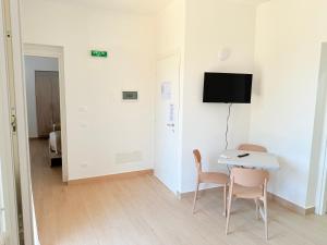 TV a/nebo společenská místnost v ubytování Casa Ferrante