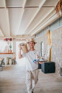 a man holding a plate of food in a room at Hotel Savoy in Opatija +270 photos