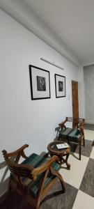 a living room with two chairs and a couch at The Hill Crest, Fagu in Shimla