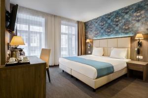Cama o camas de una habitación en Dansaert Hotel