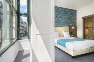 Cama o camas de una habitación en Dansaert Hotel