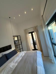 a bedroom with a large bed and a large window at 3Liebenauer Boutique Apartments in Worms