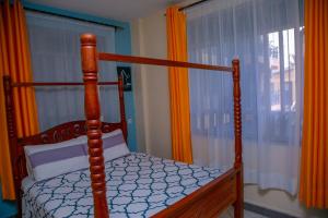 Ένα ή περισσότερα κρεβάτια σε δωμάτιο στο Amazing apartment in Milimani -Kisumu
