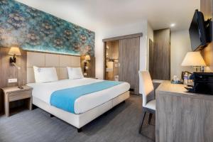 Cama o camas de una habitación en Dansaert Hotel
