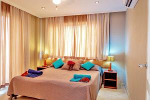 a bedroom with a bed with two pillows on it at Ocean View Apartment Flounder at Den Laman in Kralendijk