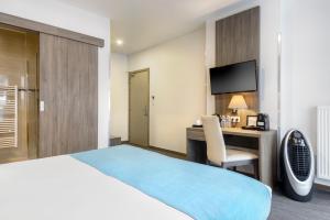 Cama o camas de una habitación en Dansaert Hotel